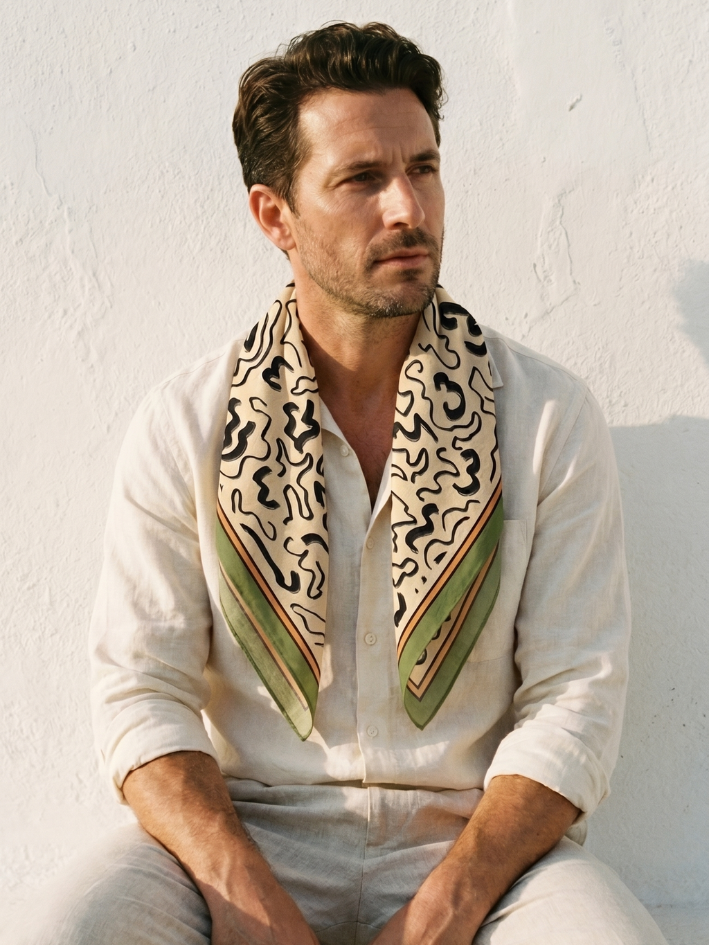 Maison OYO men's large 100% linen square scarf, Sirocco design 75x75 cm, black abstract organic patterns on cream background with sage green and burnt orange borders.