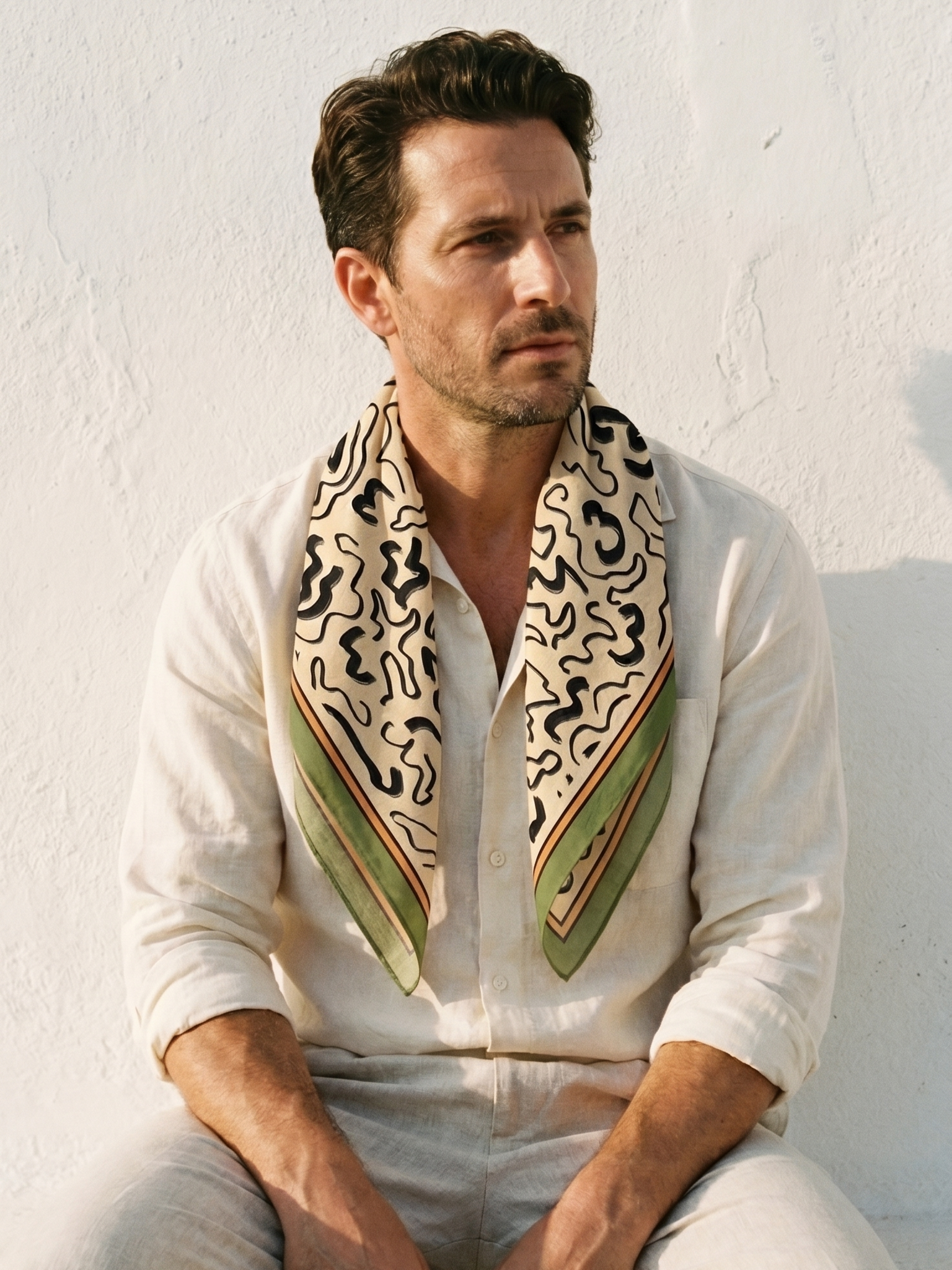 Maison OYO men's large 100% linen square scarf, Sirocco design 75x75 cm, black abstract organic patterns on cream background with sage green and burnt orange borders.